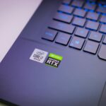 Laptop keyboard with Intel Core i7 and NVIDIA GeForce RTX stickers, symbolizing high-performance computing power.